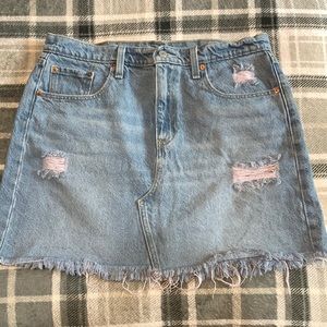 Levi’s denim mini skirt, color blue, size 31 waist.